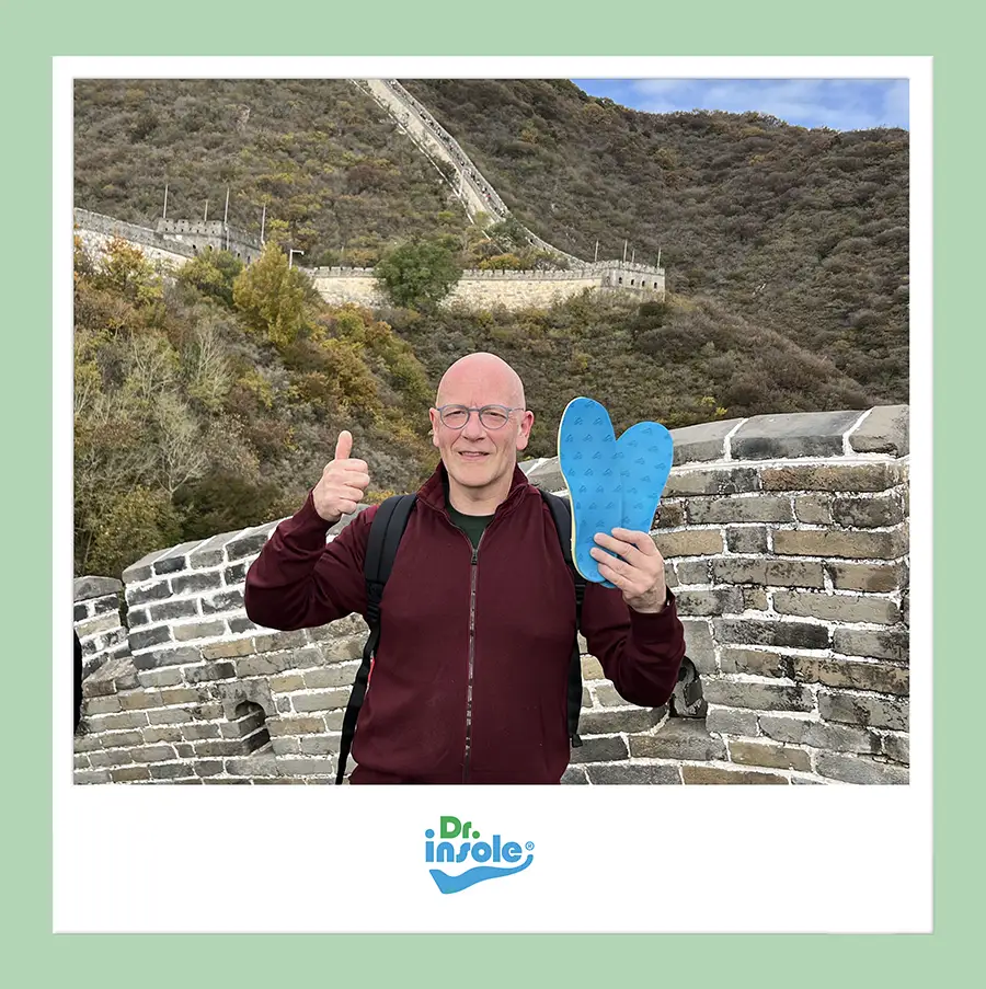 Customer using Dr Insole custom hiking orthotics on the Great Wall of China.