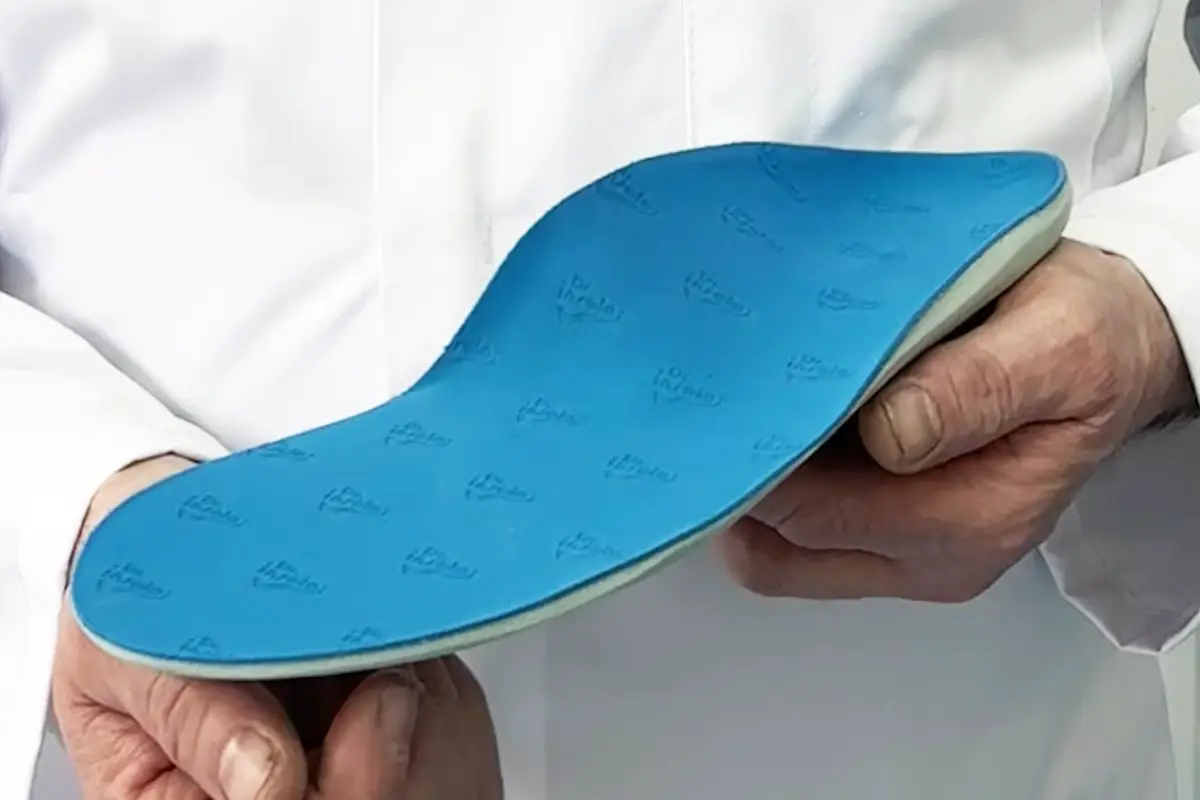 Hand-made full-length custom orthotic insole finished and ready to be fitted into the customer’s shoe.
